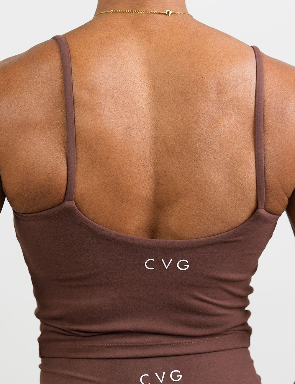 back of the light brown cami top against a white background