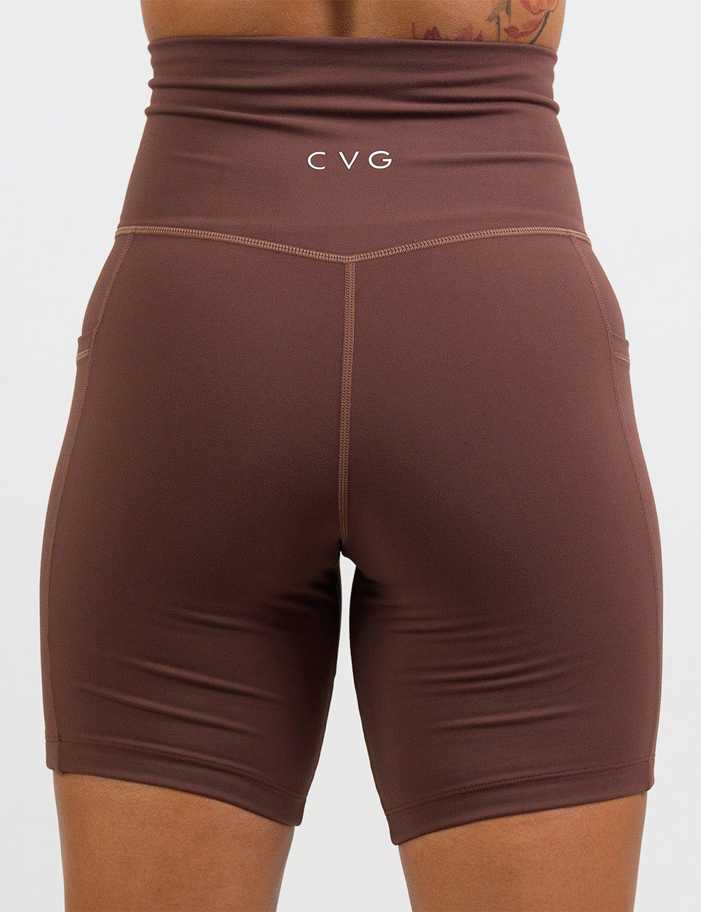 back of the solid light brown 7 inch shorts against a white background