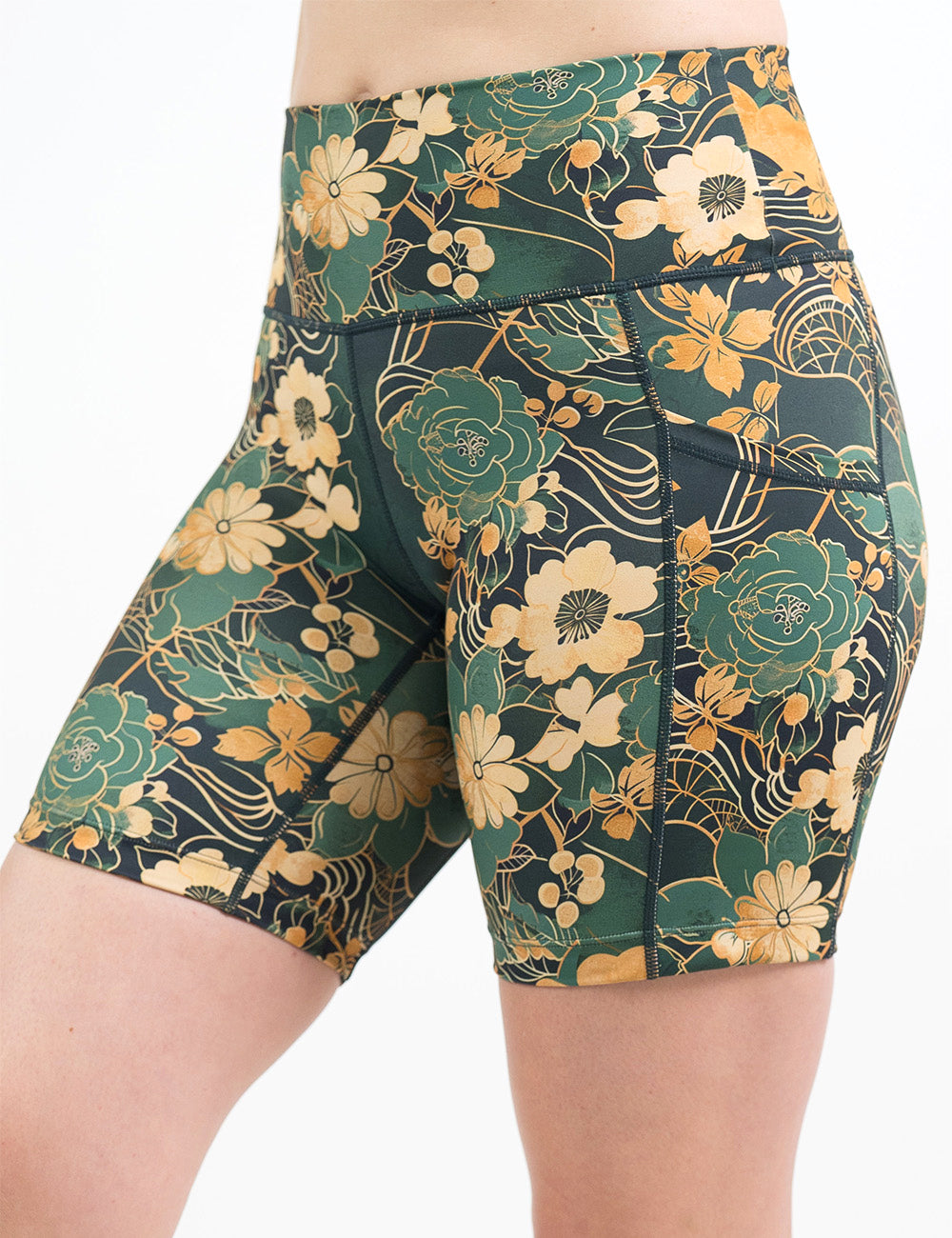 front of the 7 inch green and gold flower with gold accent shorts