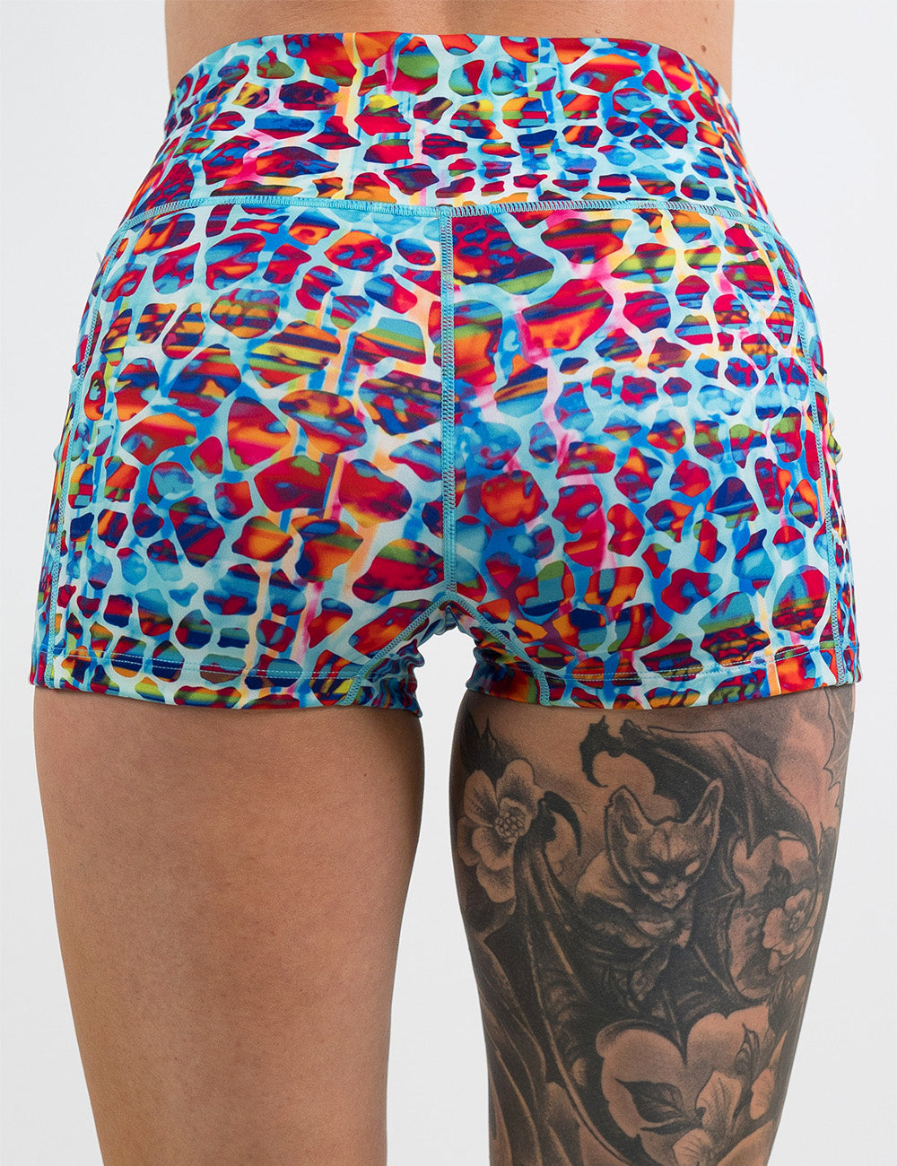 back of the 2.5 inch red, teal, and yellow mosaic style shorts against a white background