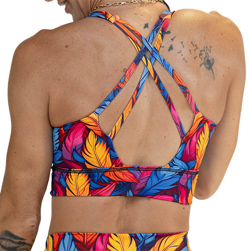 back of colorful feather patterned sports bra