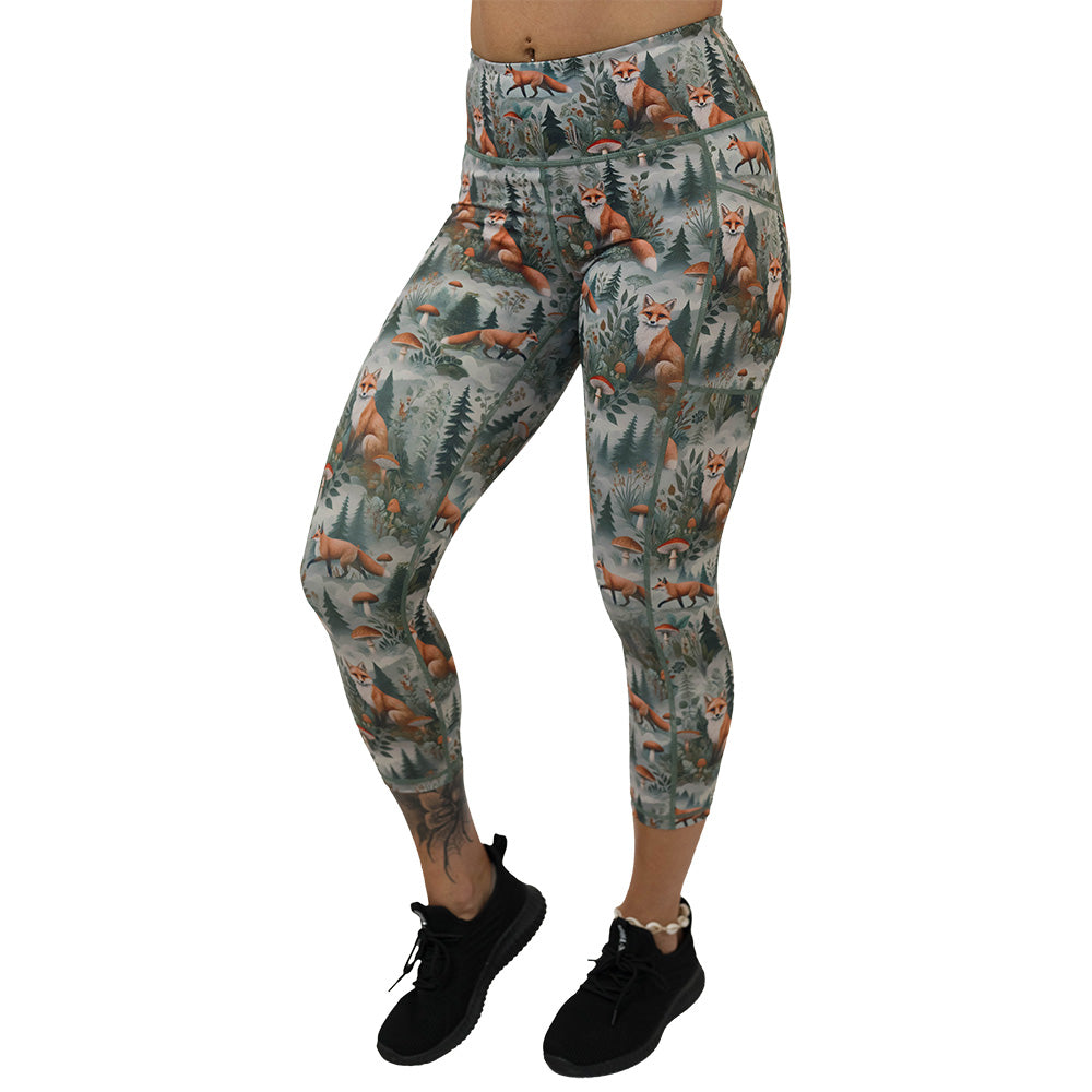 High-waisted leggings with fox and forest pattern on them