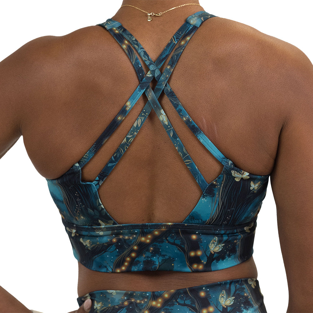 back of the forest filled with firefly's pattern bra against a white background