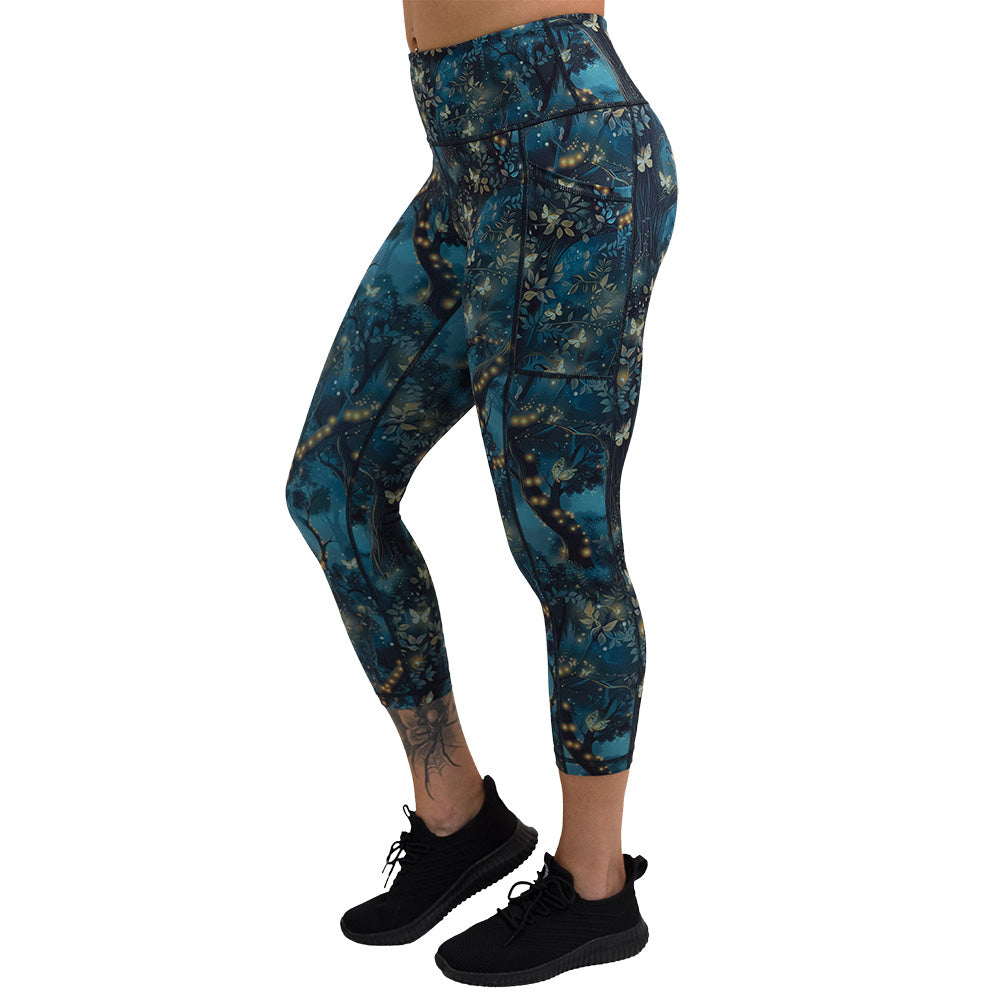 forest filled with firefly's pattern capri leggings facing the side against a white background