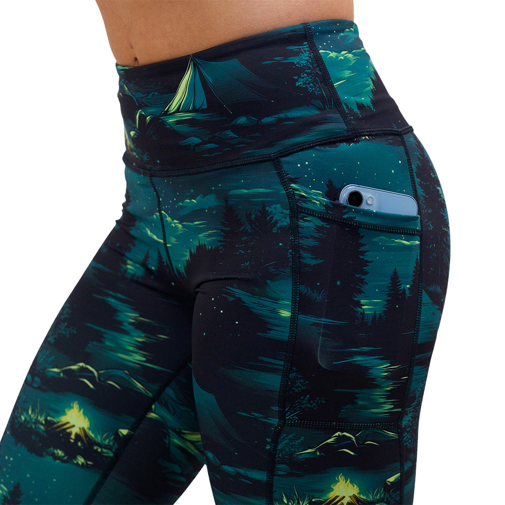 close up of the night time camp out leggings with a phone in its pocket against a white background