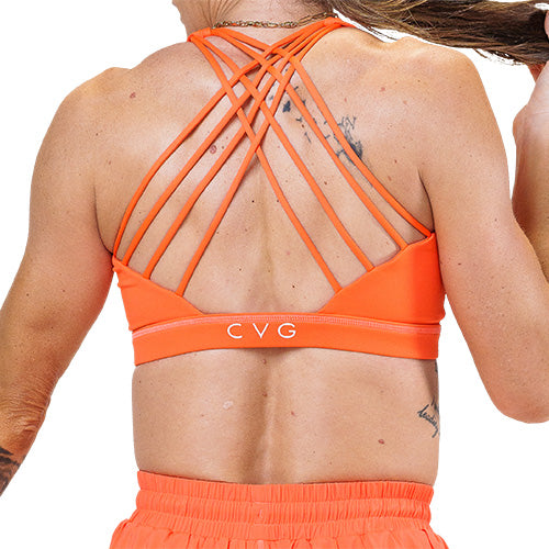back of neon orange sports bra