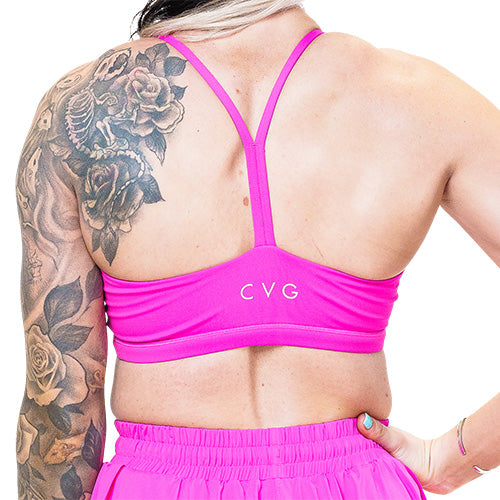 back of pink sports bra