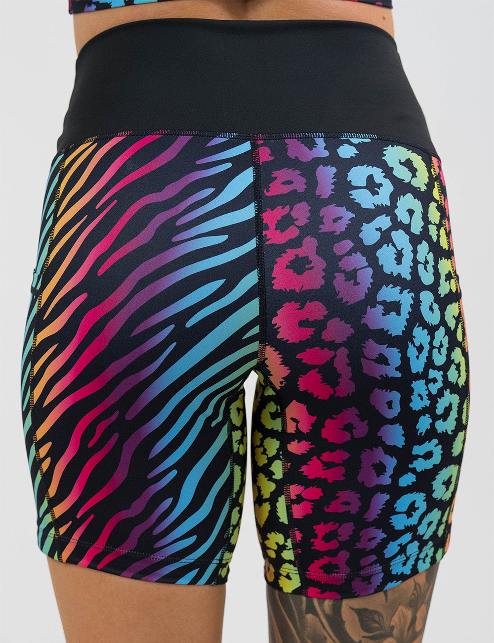 back of the 7 inch zebra and leopard rainbow print shorts against a white background