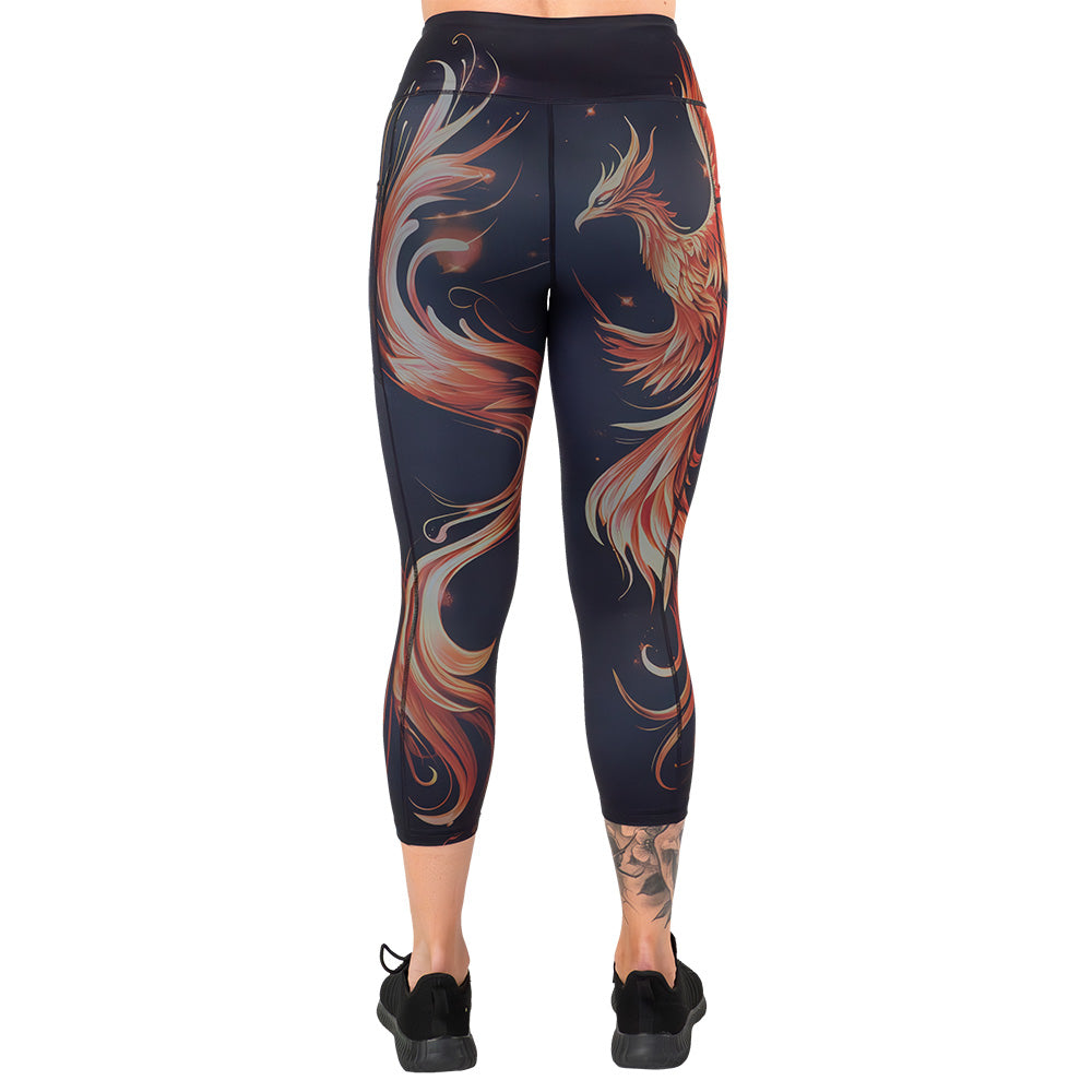 back of the black leggings with a red and orange phoenix graphic on it