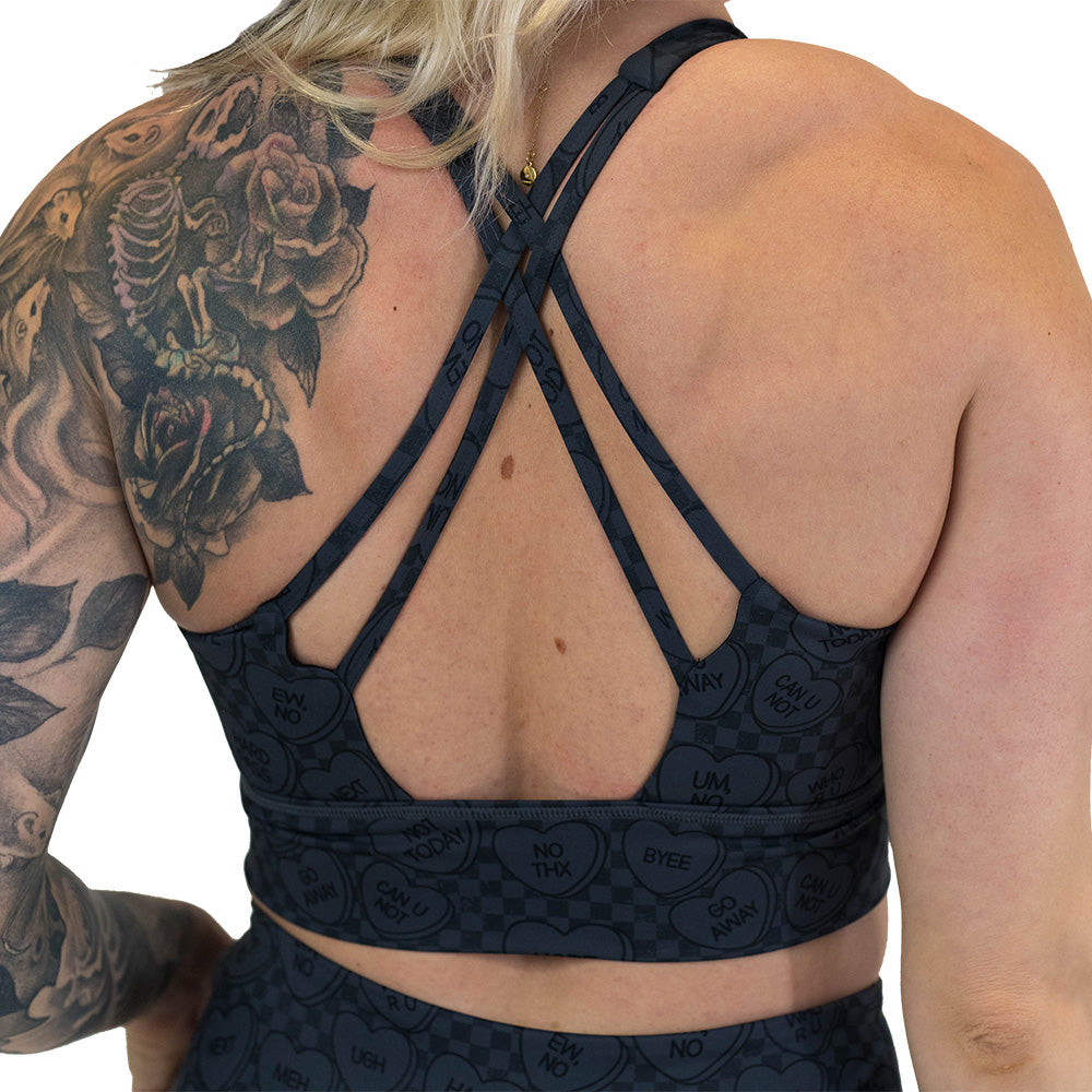 back of the black and grey heart patterned longline sports bra