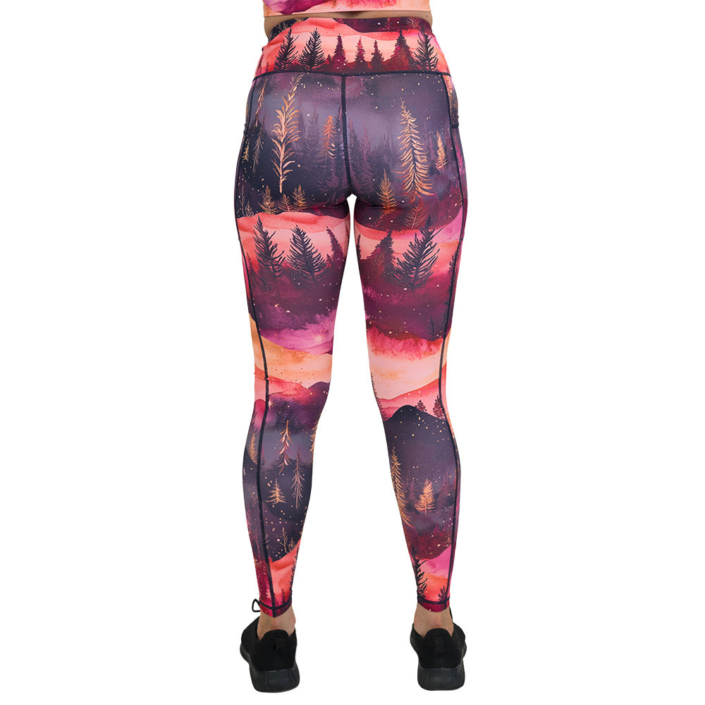 back of the leggings with forest design and red ombre sky