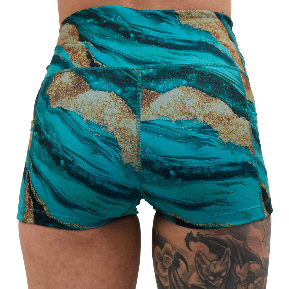 back of the 2.5 inch blue ocean with gold streaks patterned short against a white background