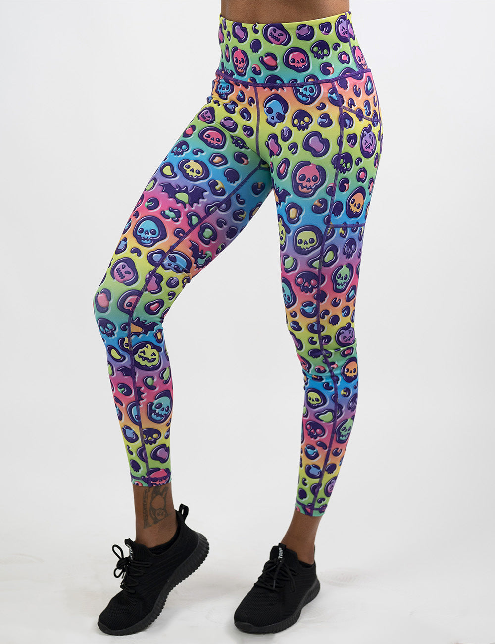 front of the rainbow leopard print pumpkins and skulls full length leggings against a white background