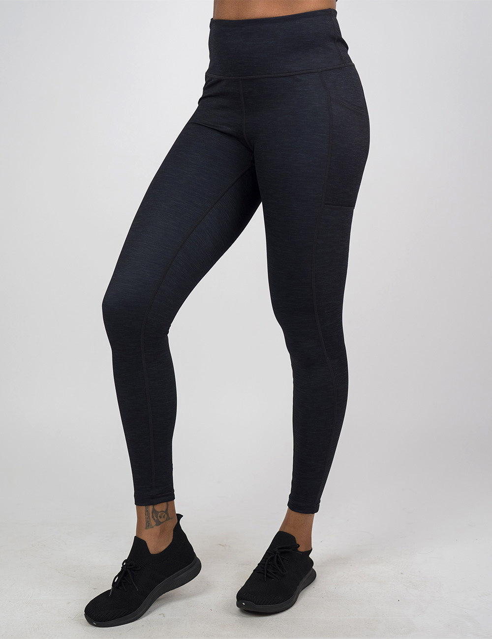 front of the full length black heather pattern leggings against a white background