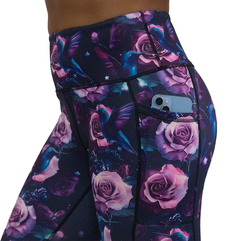 leggings with a design of a blue hummingbird and pink roses