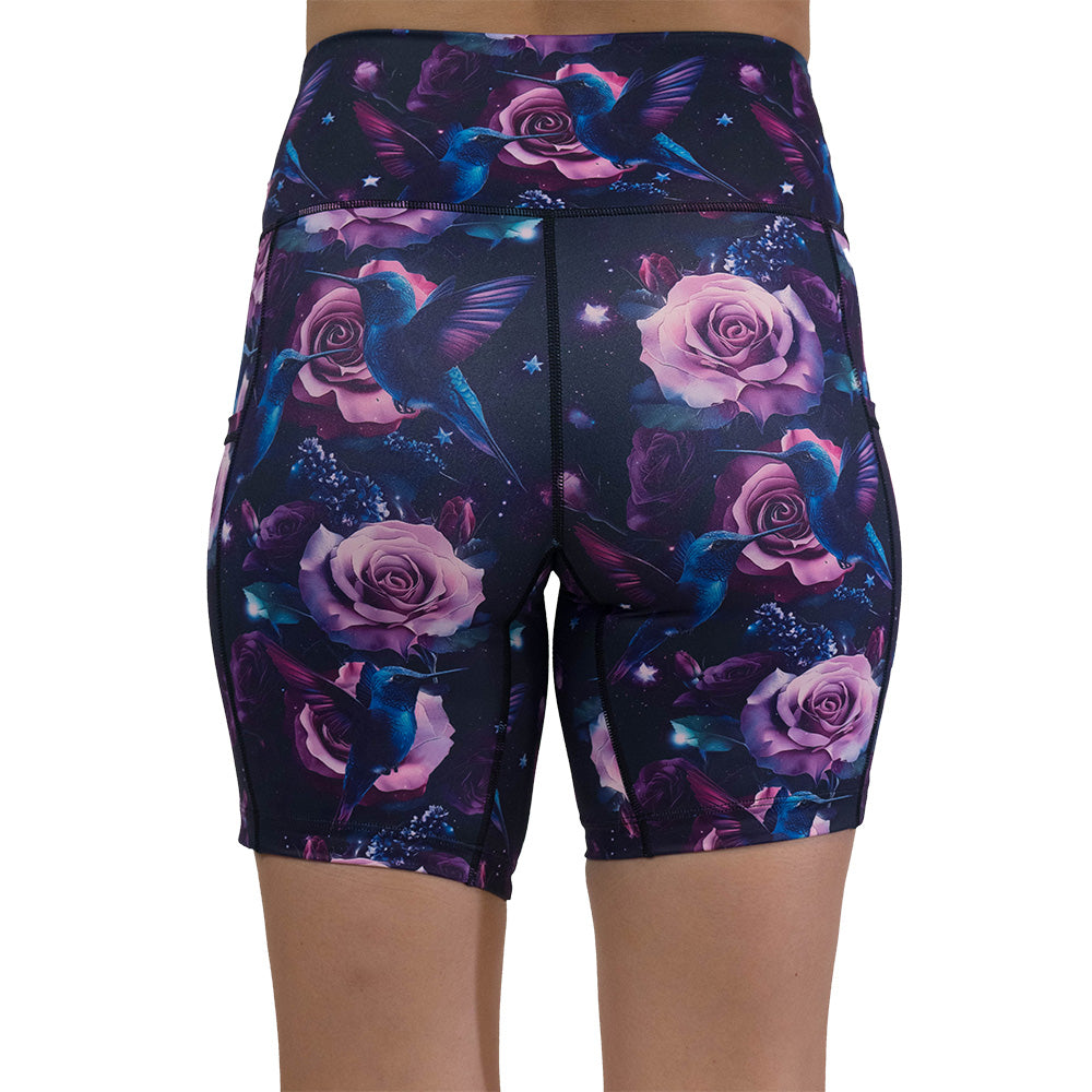 back of the shorts with a design of a blue hummingbird and pink roses