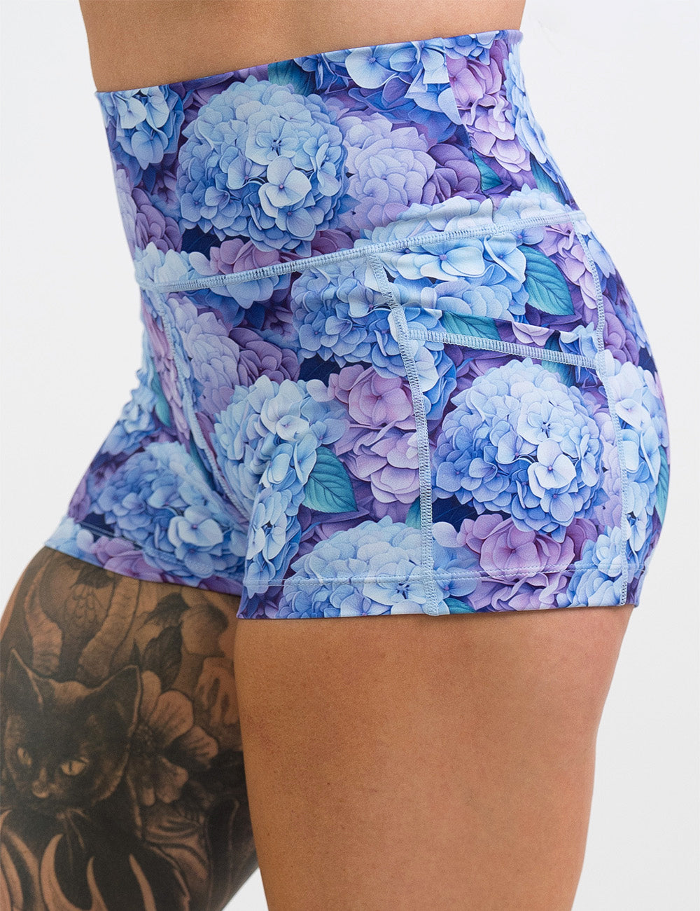 front of the 2.5 inch blue and purple pastel flowers shorts against a white background
