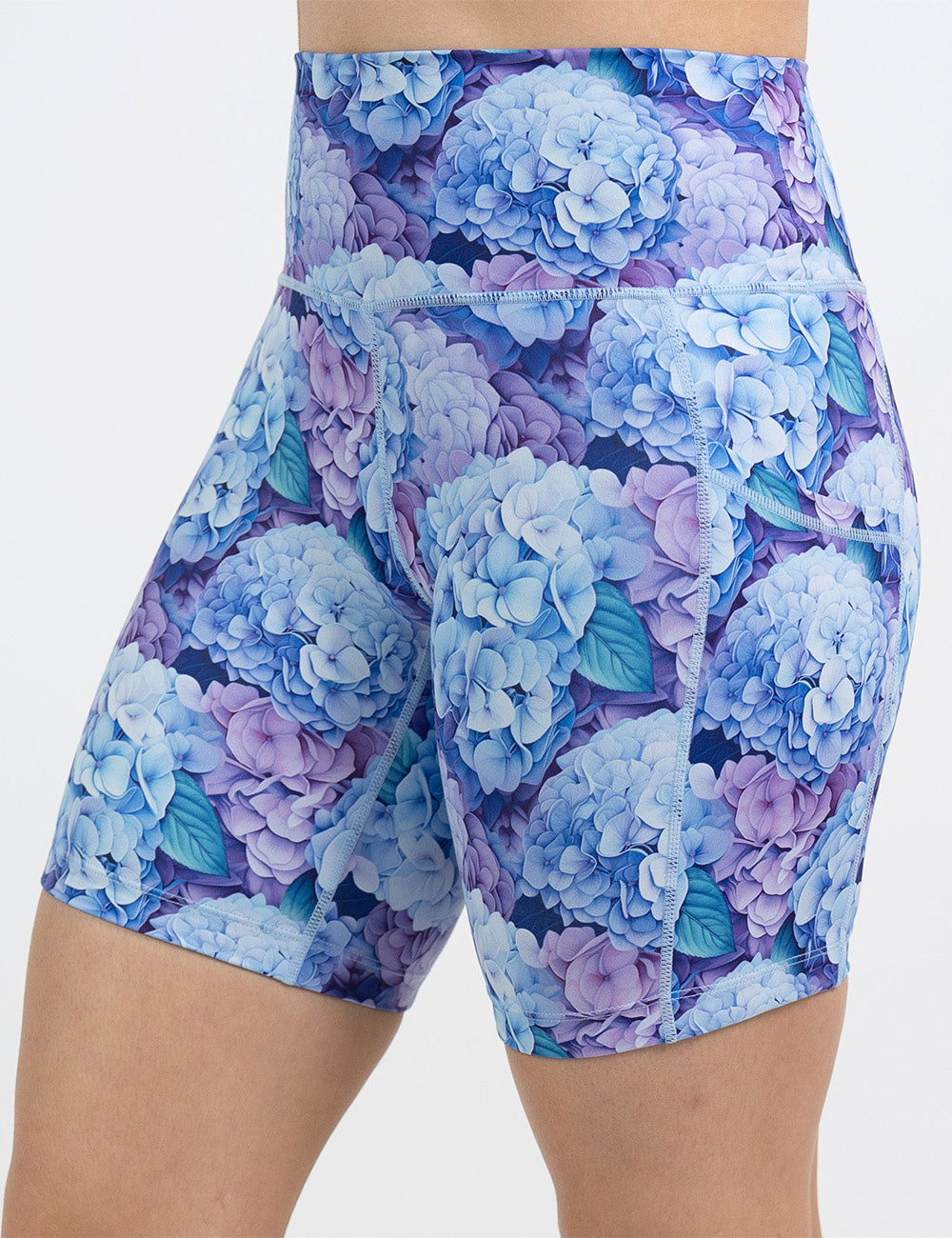 front of the 7 inch blue and purple pastel flowers shorts against a white background