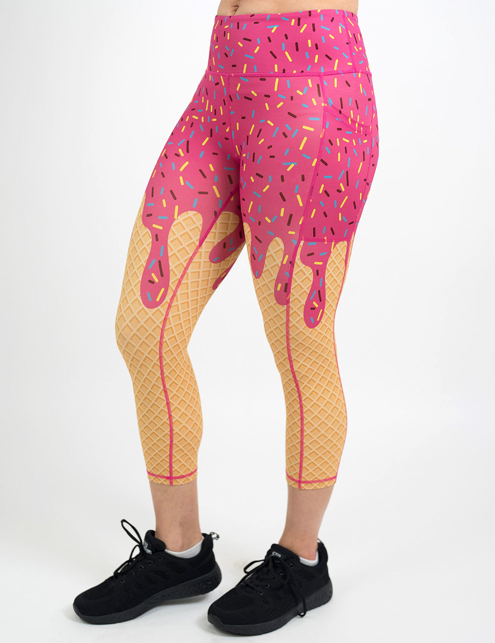 front of the pink ice cream cone with sprinkles capri leggings against a white background