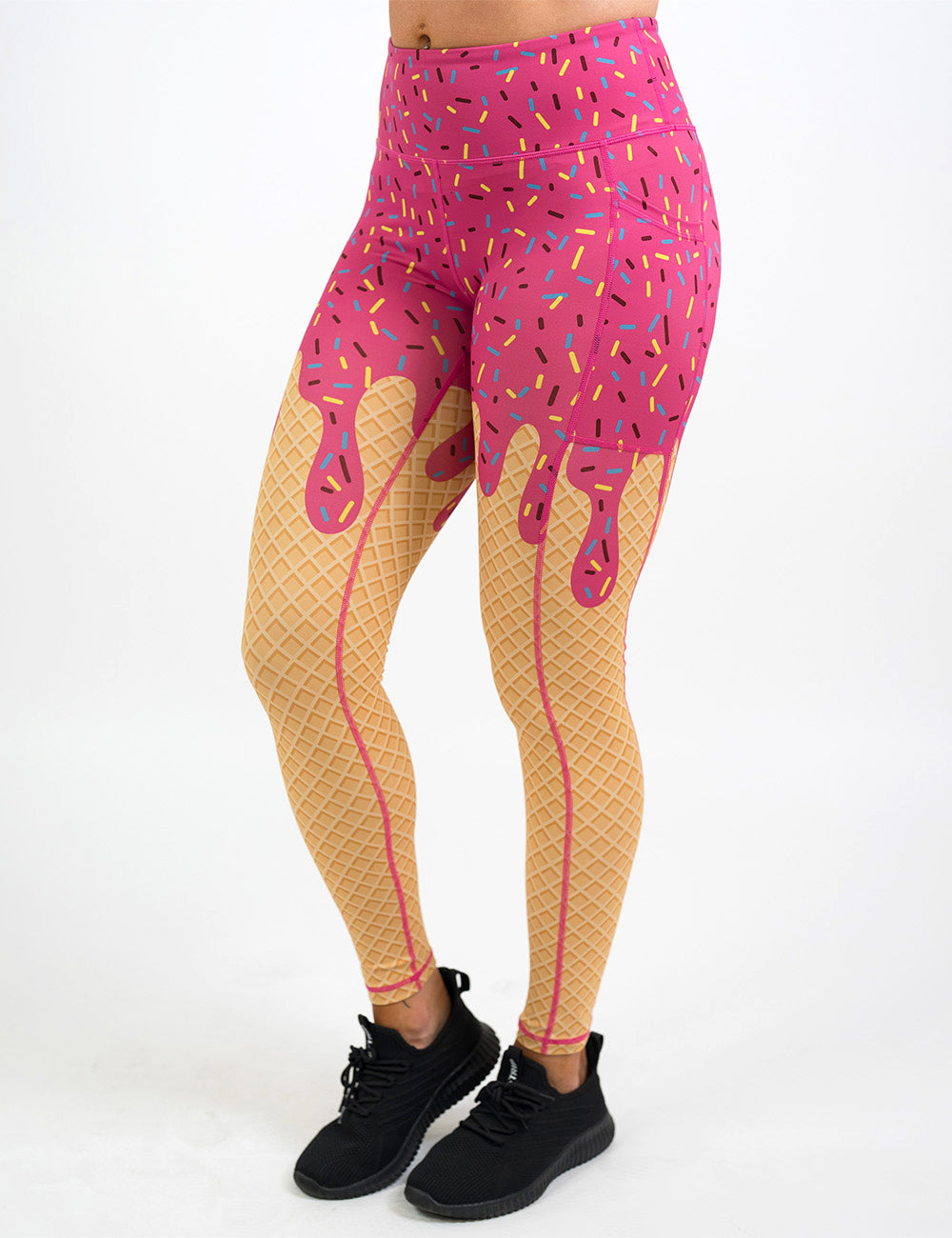 front of the pink ice cream cone with sprinkles full length leggings against a white background