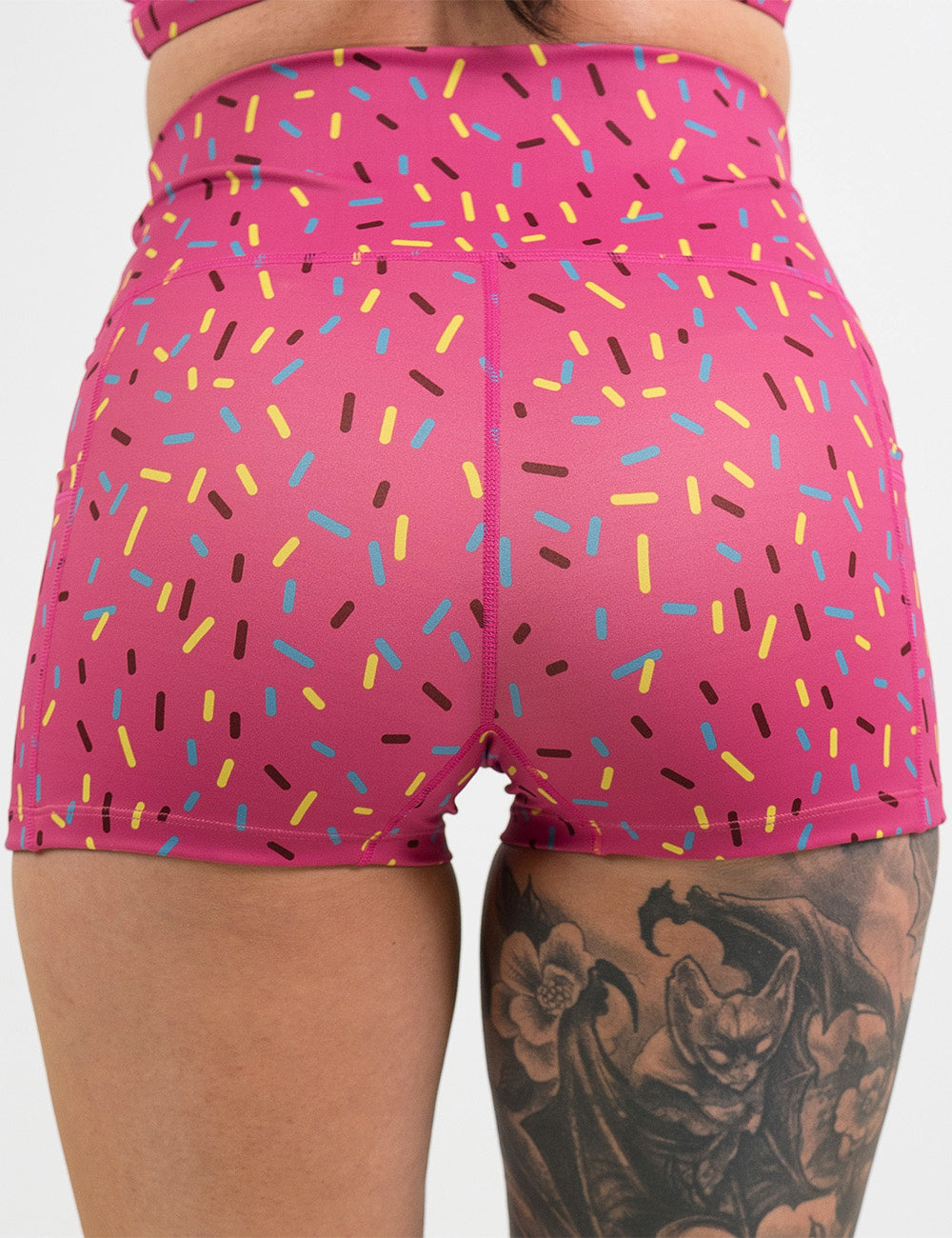 back of the 2.5 inch pink shorts with a sprinkles pattern against a white background