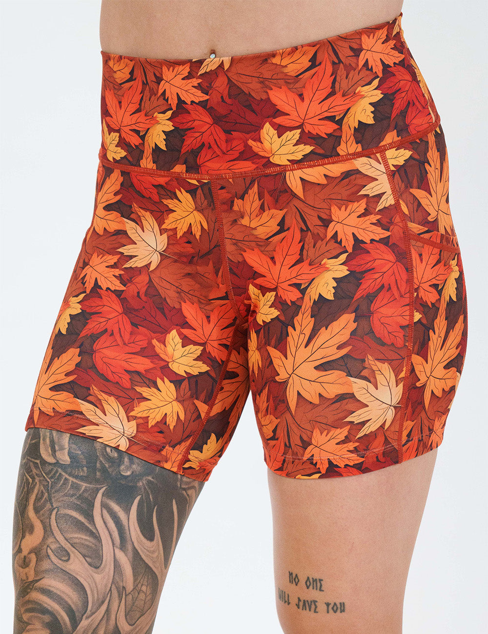 front of the 5 inch orange leaves shorts against a white background