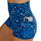 close up of the side pocket on the blue snowflake patterned shorts