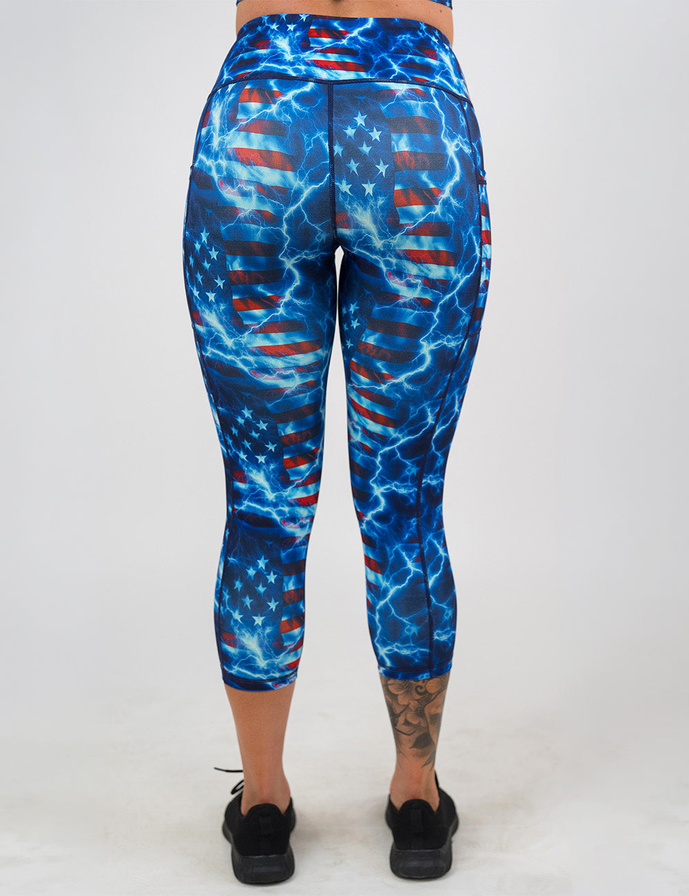 back of the capri lightning flag leggings against a white background