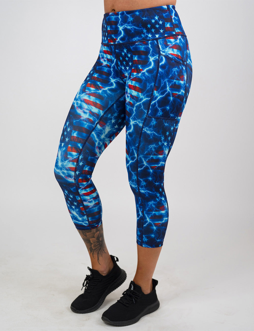 front of the lightning flag capri leggings against a white background