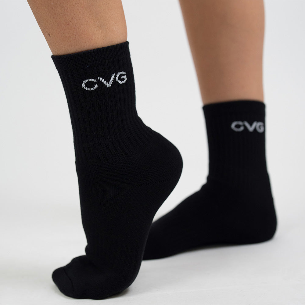 Black socks with 'CVG' logo on a light gray background