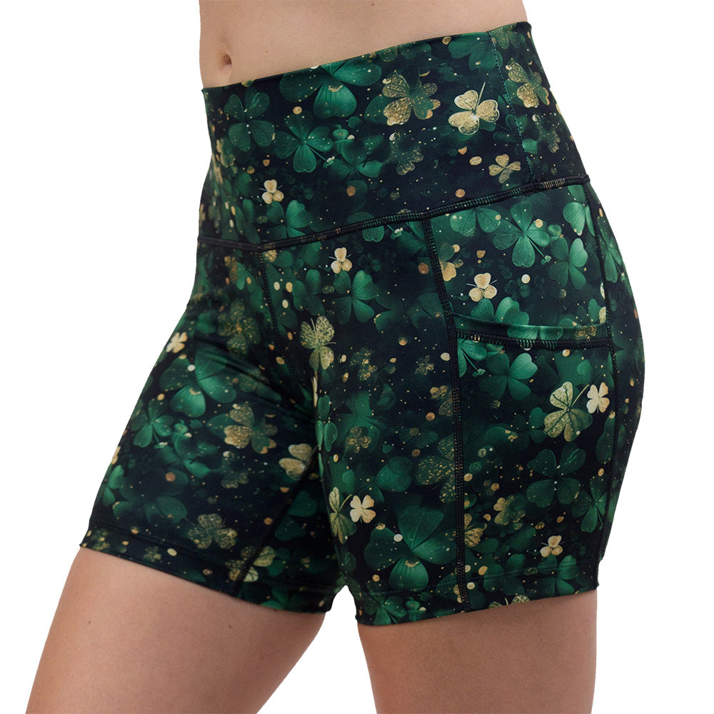 green and gold shamrock patterned 5 inch shorts facing the front against a white background