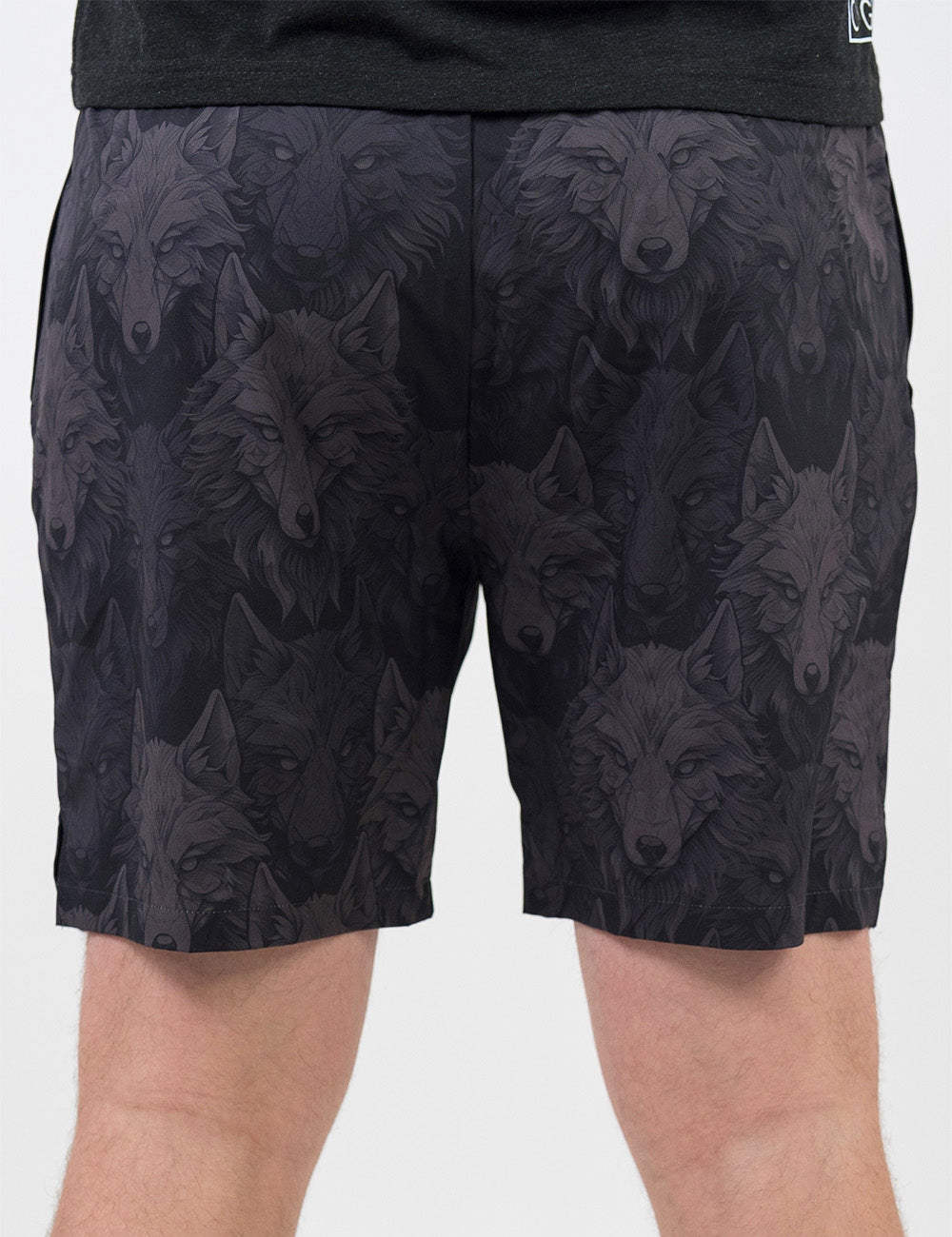 back of the black men's shorts with grey wolves against a white background