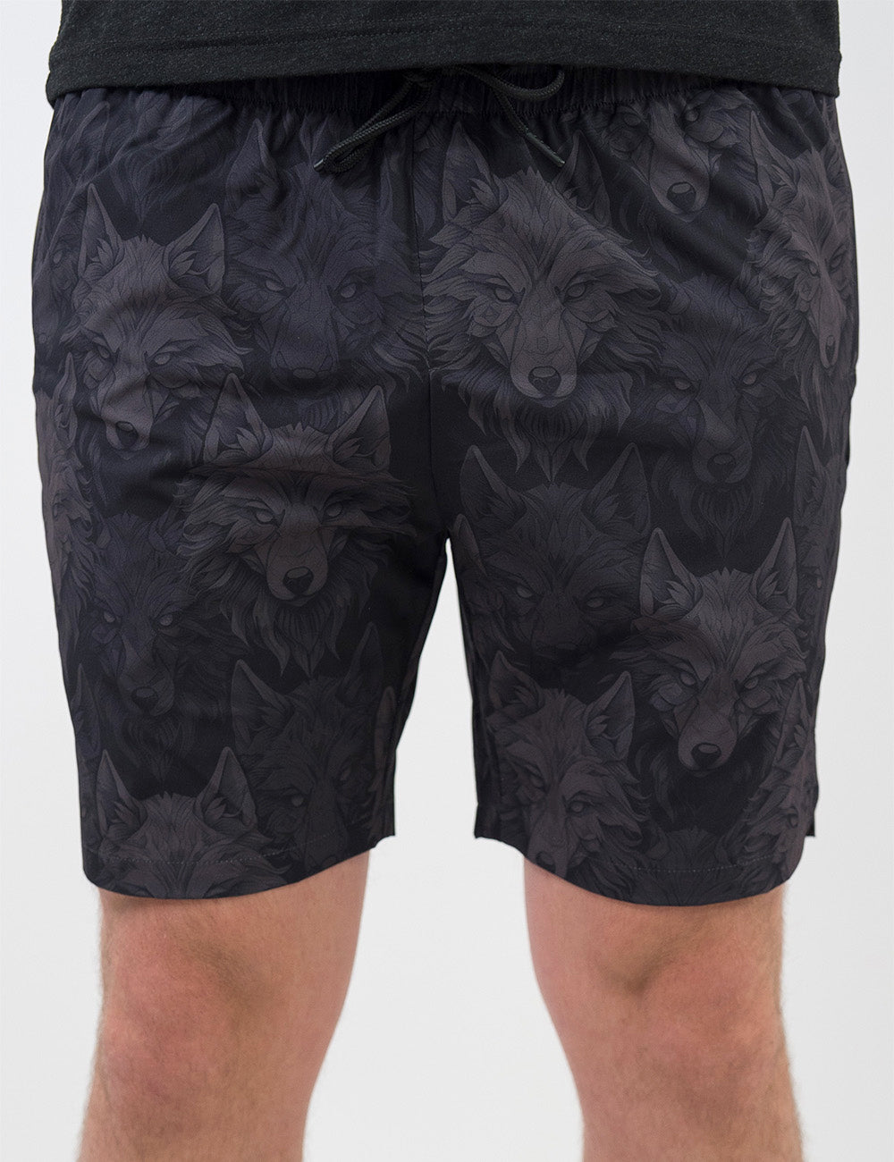 front of the black men's shorts with grey wolves against a white background