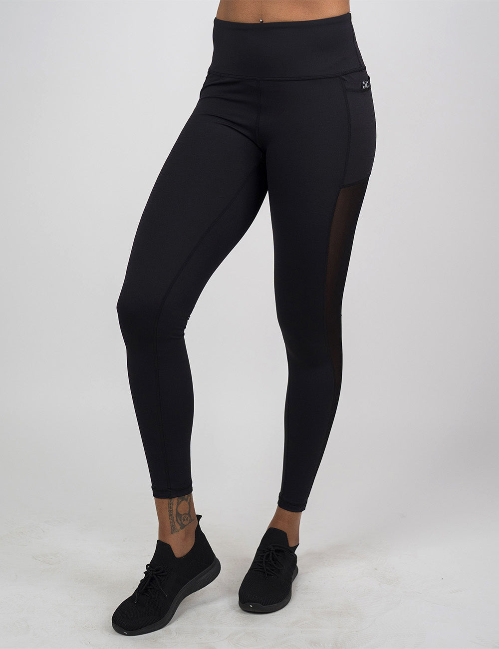 front of the full length black mesh leggings against a white background