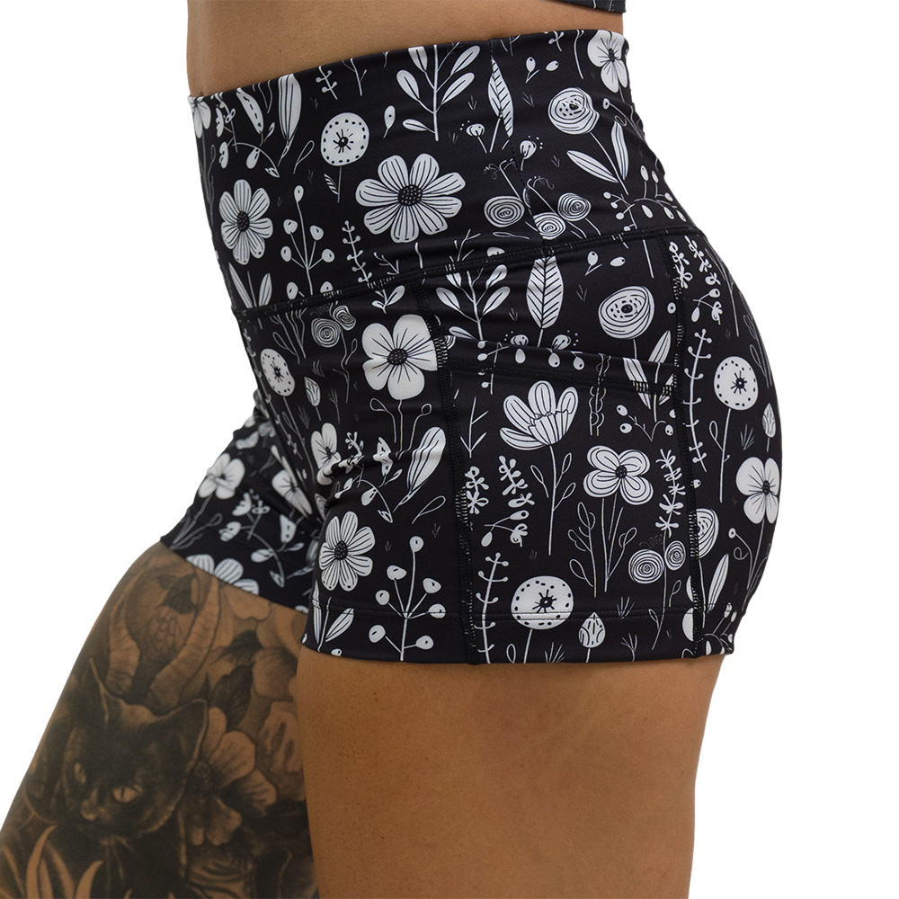 black and white floral 2.5 inch shorts facing the side