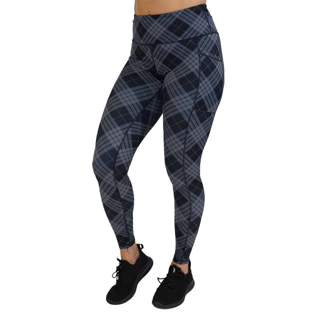 Plaid patterned leggings on a white background