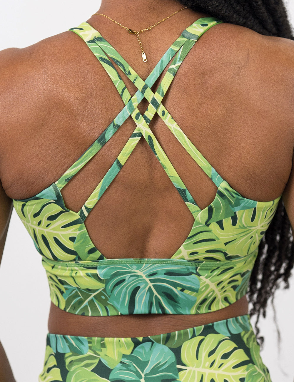 back of the vibrant tropical leaves shorts against a white background