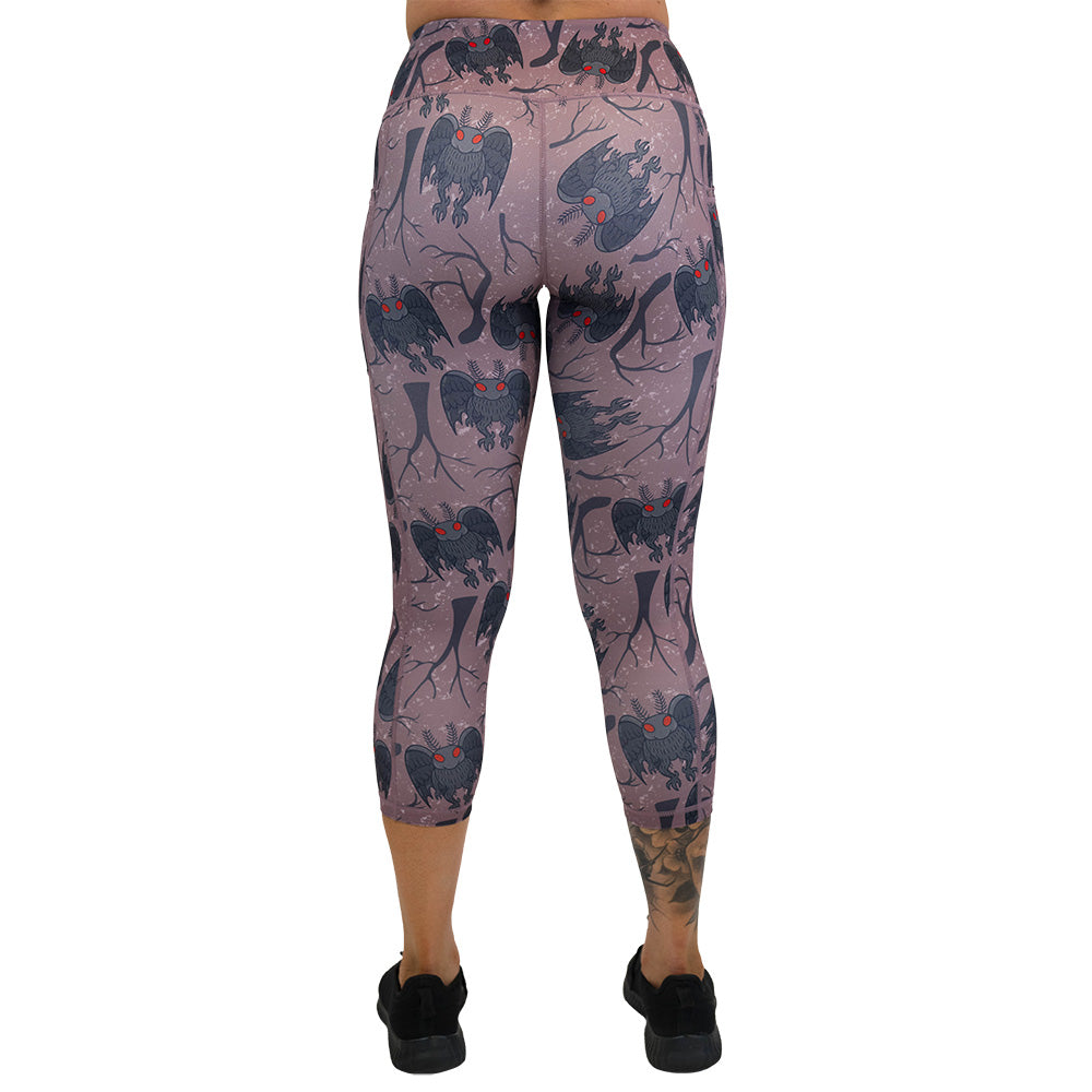 back of the cartoon mothman print leggings