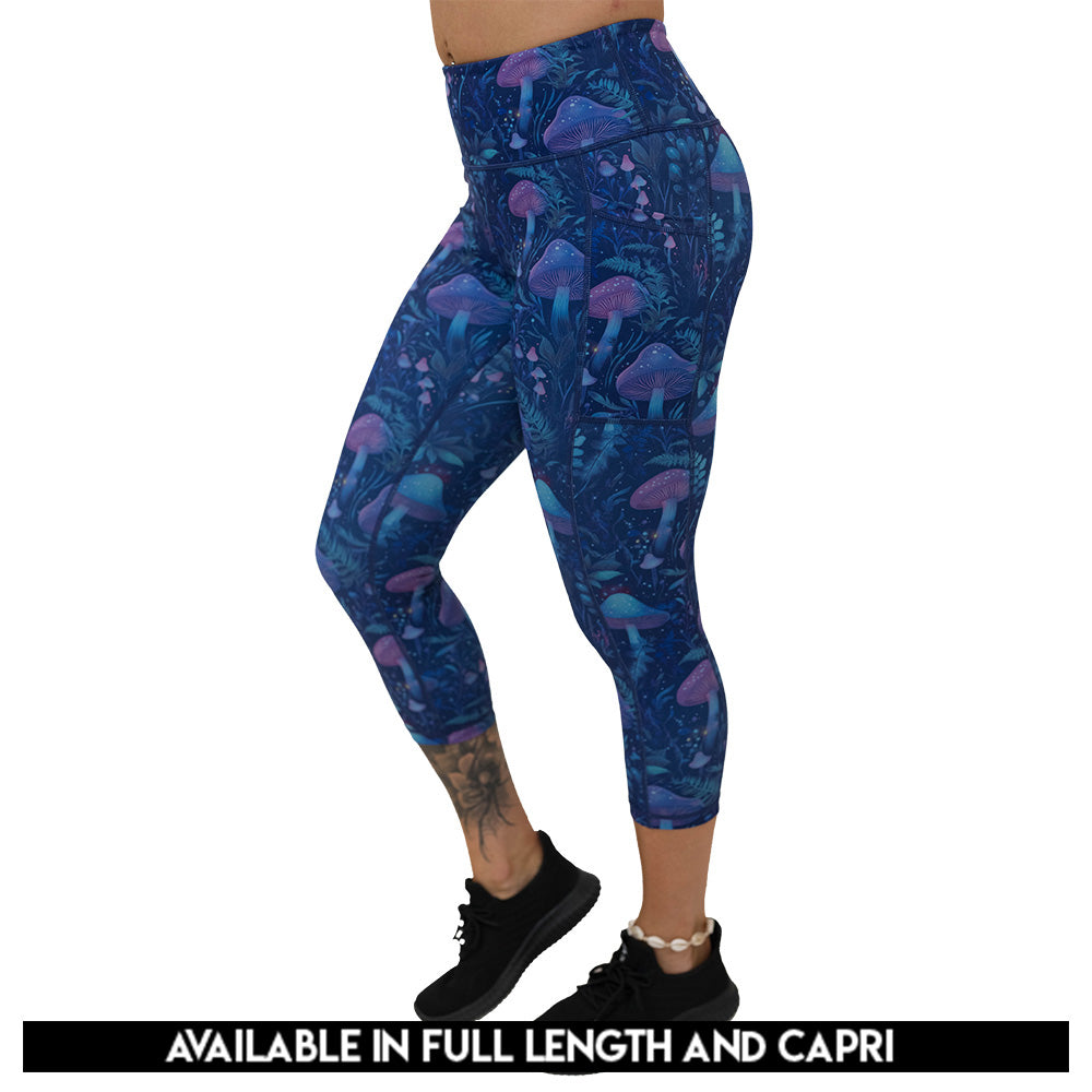 leggings with a blue and purple mushroom and foliage design on a white background