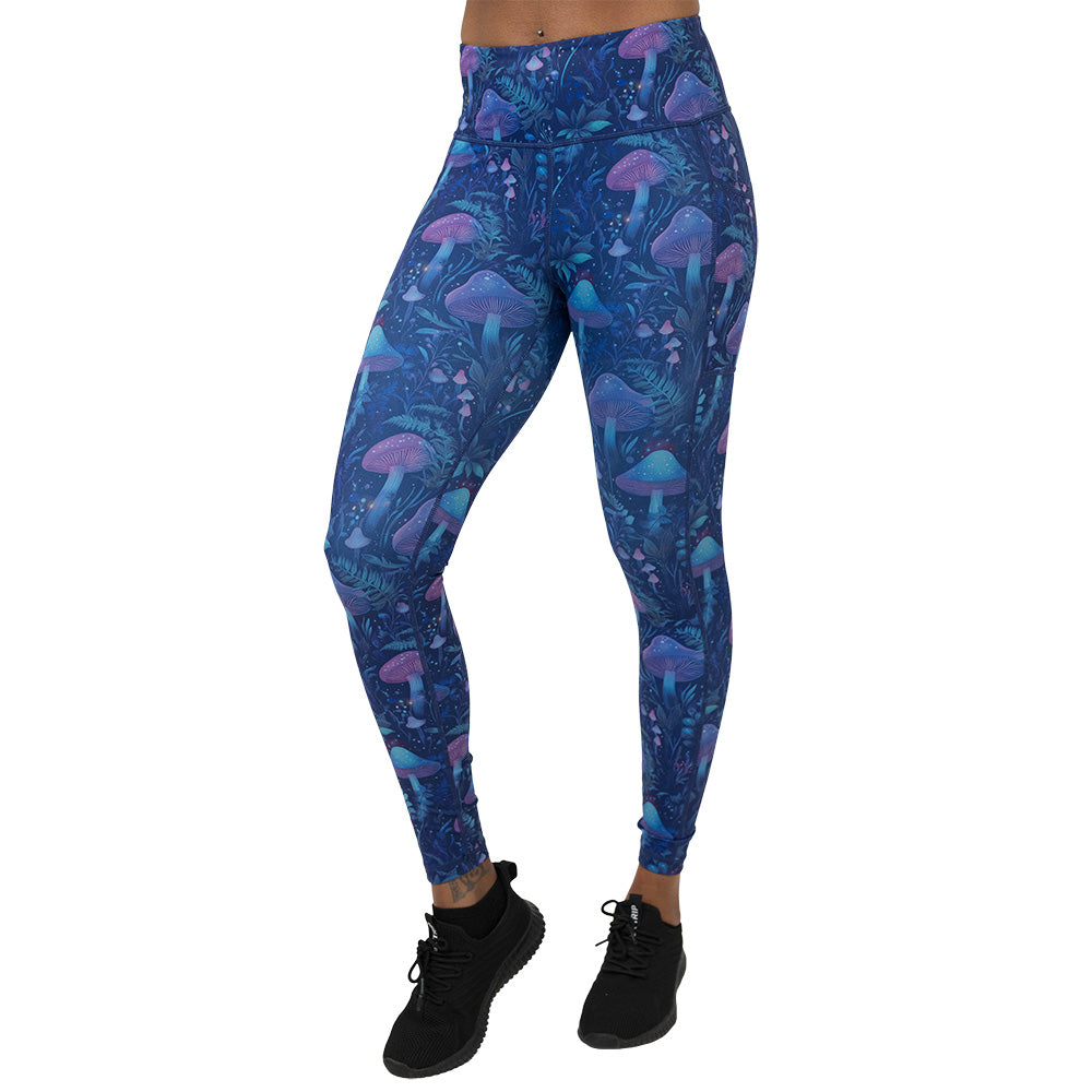 leggings with a blue and purple mushroom and foliage design on a white background