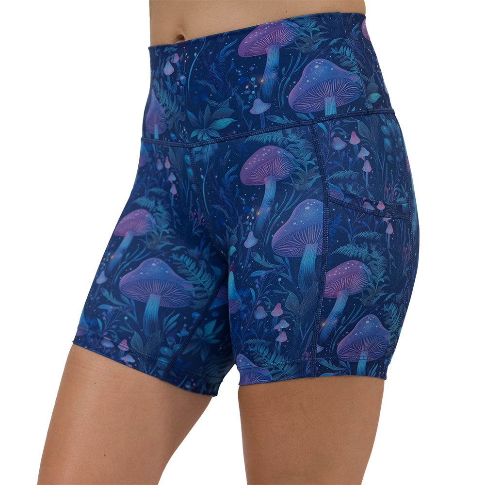 shorts with a blue and purple mushroom and foliage design on a white background