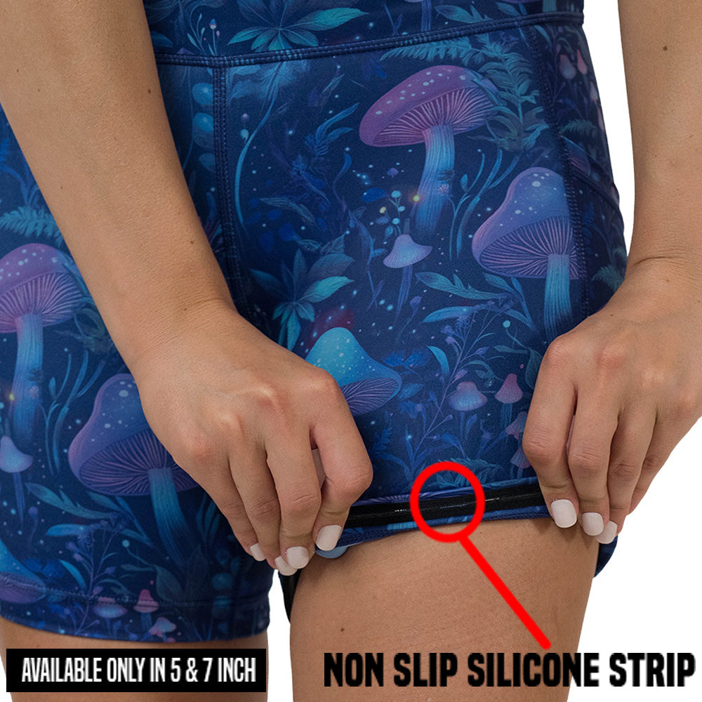 non slip strip on the shorts with a blue and purple mushroom and foliage design on a white background