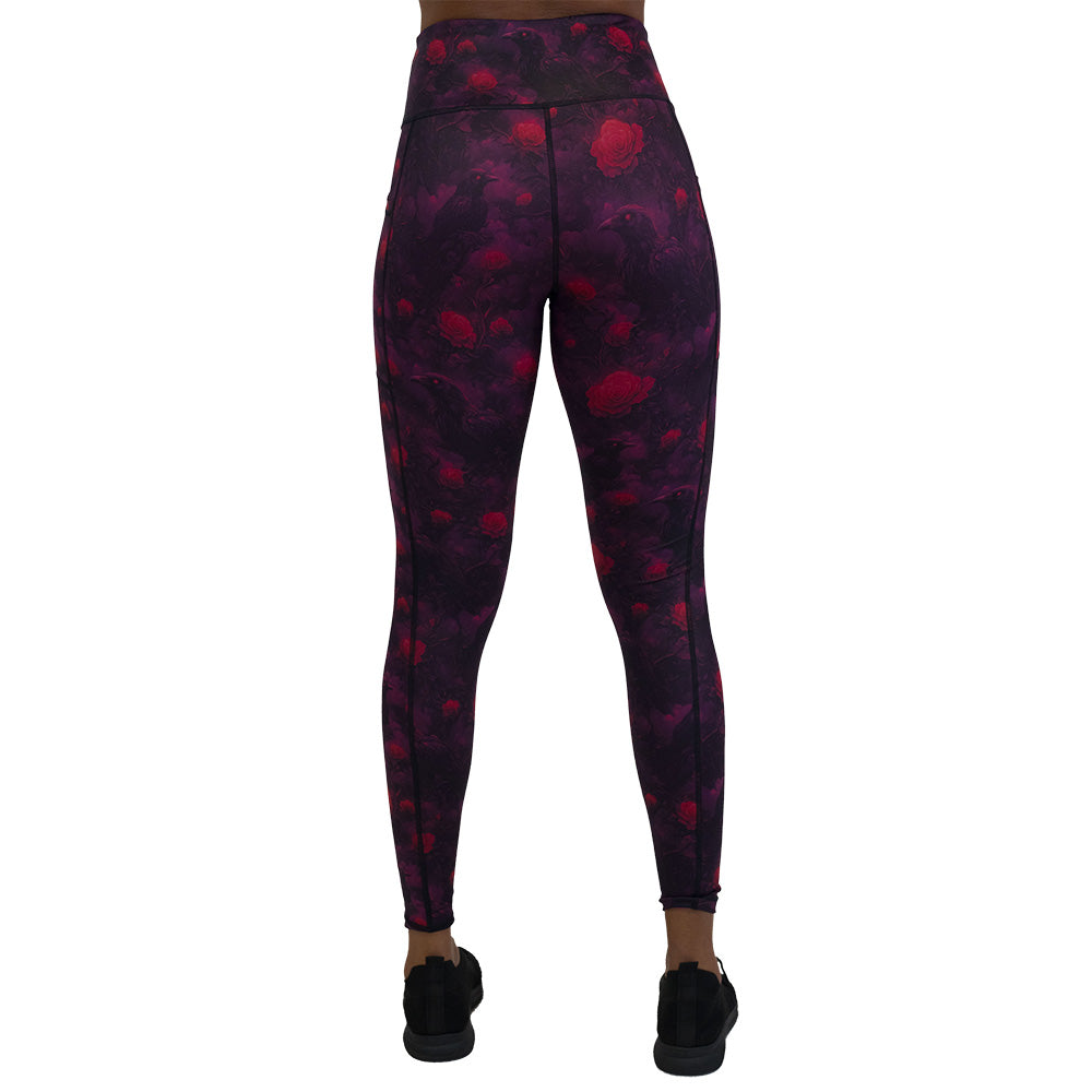 back of the Black leggings with red floral and crow pattern on it