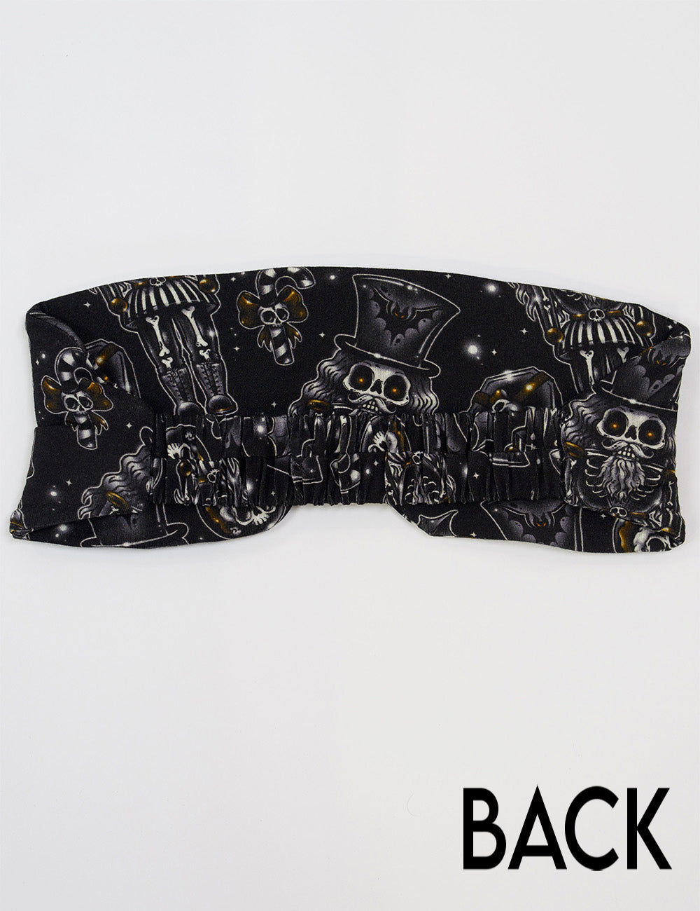 back of the black nutcrackers, mistle toe, and Christmas ornaments eye mask
