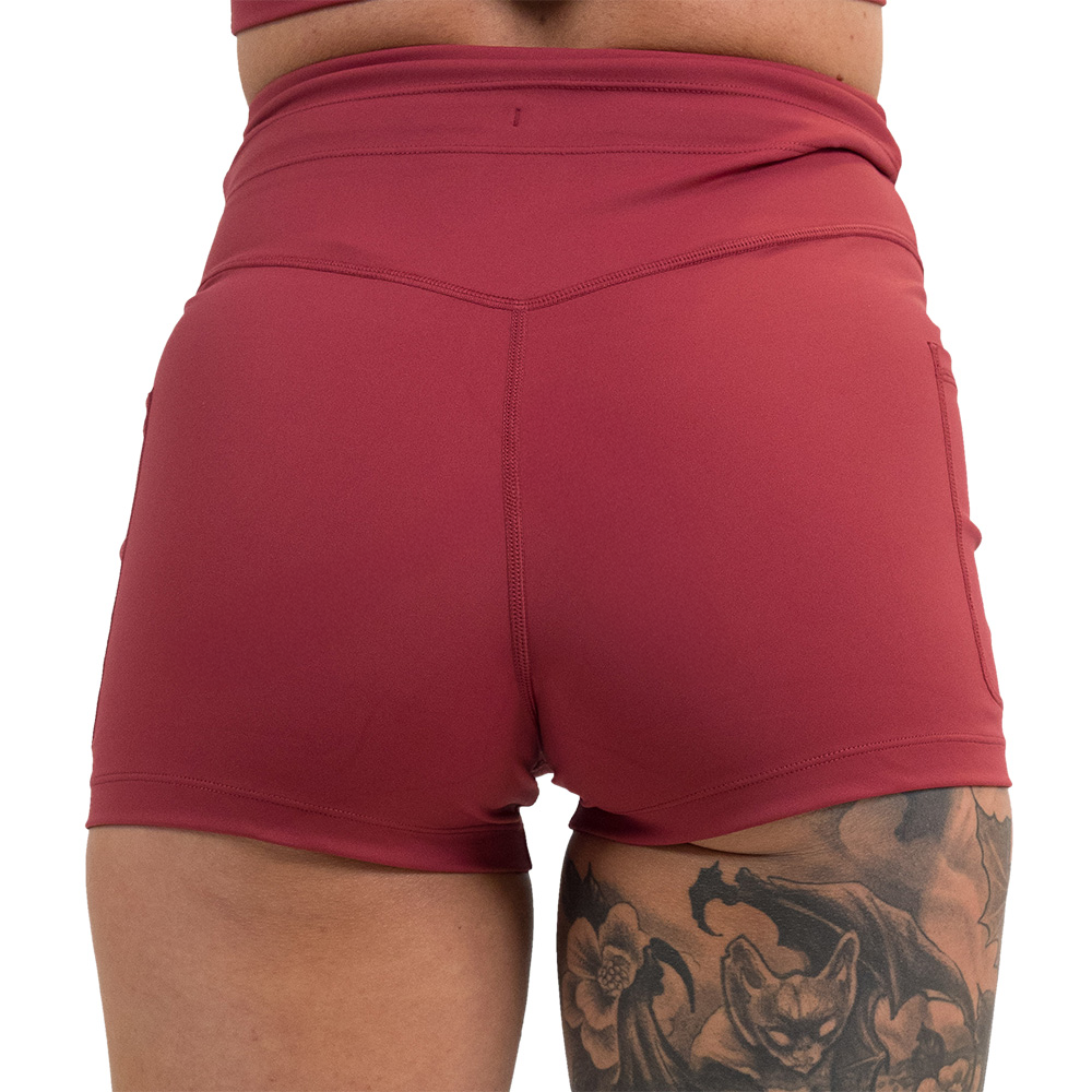 back of the omni garnet red 2.5 inch shorts against a white background