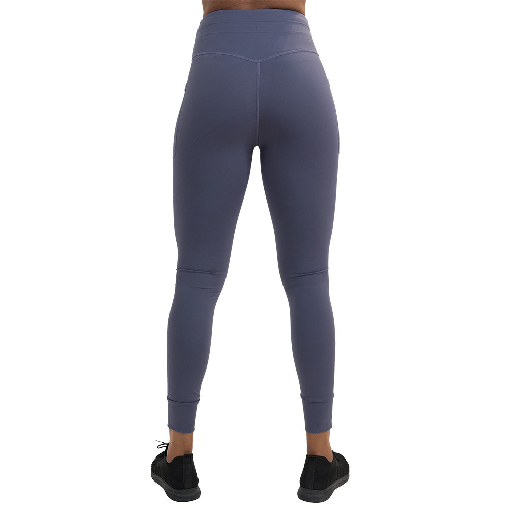 back of the omni twilight purple leggings against a white background