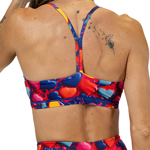 back of colorful heart pattern sports bra