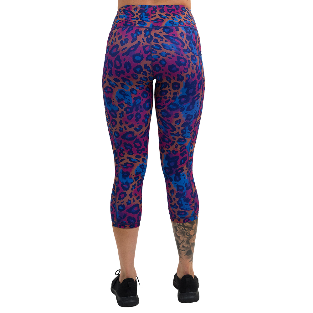 back of the cheetah print against a yellow, blue, and purple background pattern full length leggings against a white background