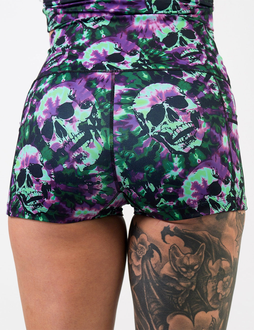 back of the purple and green tie dye skulls 2.5 inch shorts against a white background