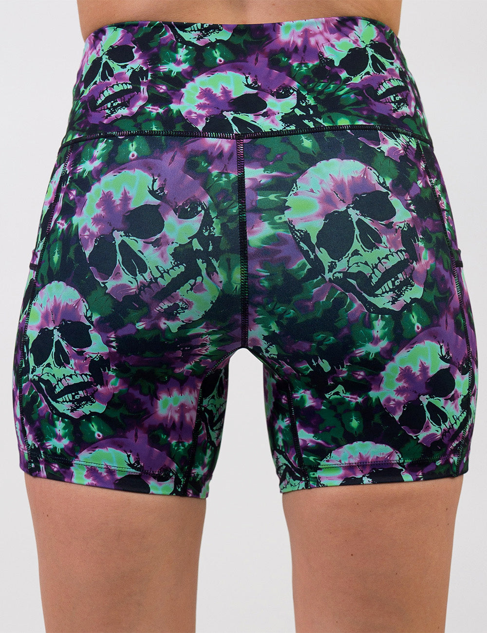 back of the 5 inch purple and green tie dye skulls shorts against a white background